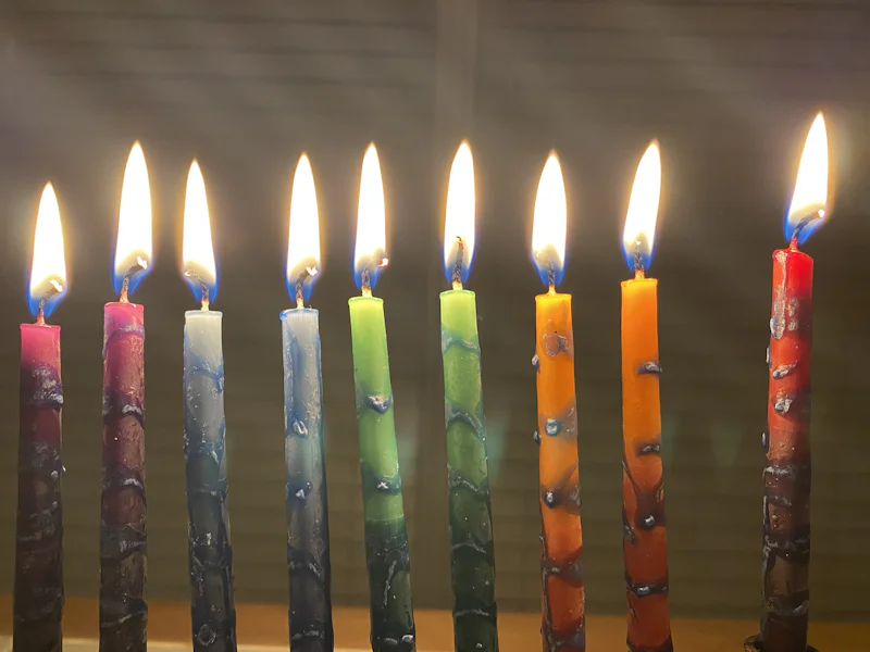 A row of lit Chanukah candles